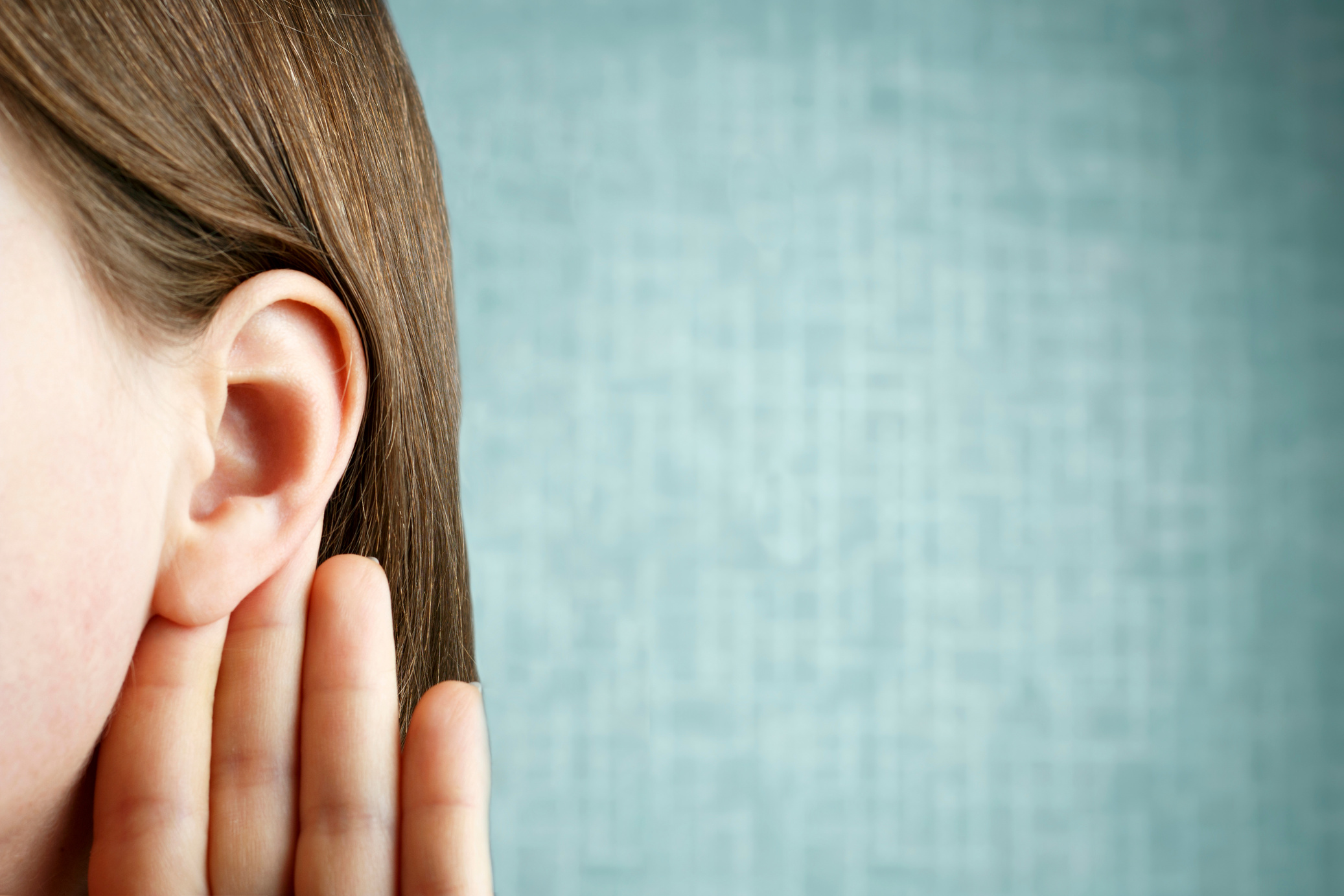 Person Listens Attentively with Her Ear